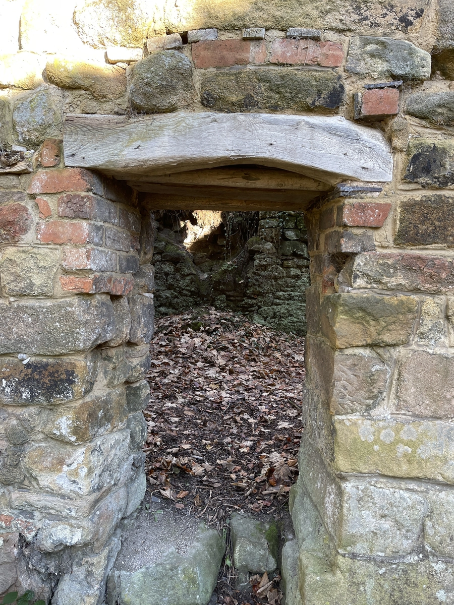 Doorway with a timber lintel and brick above